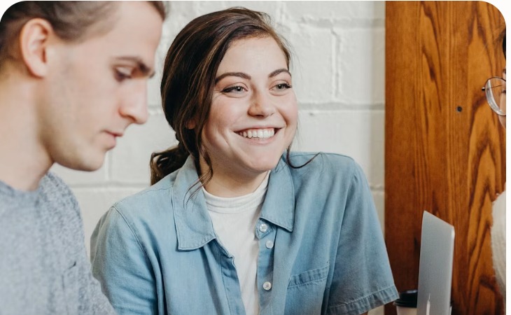 A jobseeker going through care vacancies with an adviser.